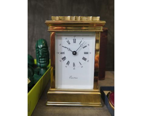 A gilt brass carriage timepiece clock, of conventional form with enamel dial inscribed Eurotime, single train movement 