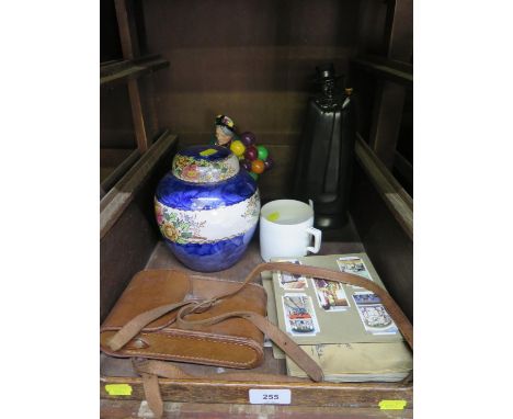 A Royal Doulton figure of the Old Balloon Seller HN 1315, a Maling Peony Rose ginger jar and cover, a Wedgwood Sandeman Port 