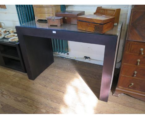 A Rebecca Scott ebony finish and suede console table, 120 cm wide, 60 cm deep, 83 cm high 