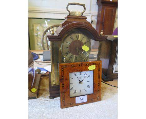 A Kundo quartz anniversary clock, 31cm high, and another quartz table clock (2)