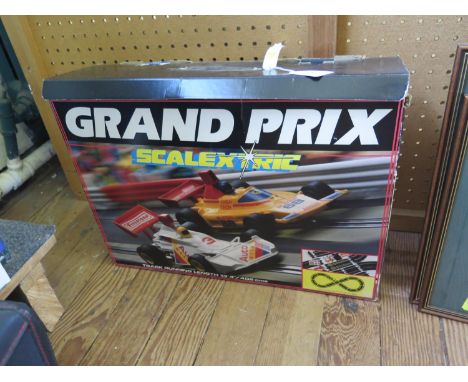 Scalextric C.573 Grand Prix racing set, two cars, power unit, hand controllers, track, instructions and 32nd edition catalogu