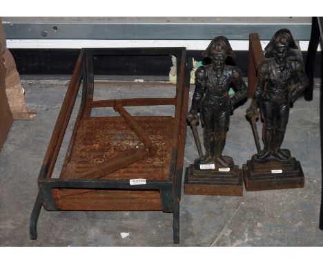 Two cast iron fire dogs&nbsp;in the form of a figure of the Duke of Wellington,&nbsp;a wrought iron fire grate and a spark gu