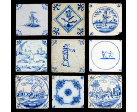 Delft. A collection of Delft tiles, mostly 18th century, 33 hand-painted blue and white pottery tiles, mostly with floral or 
