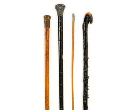 Walking Canes. A 19th century Indian silver top cane, the top embossed with birds and foliage on a simulated bamboo shaft, 93