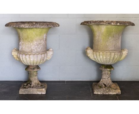 Italian Urns. A fine and rare pair of 18th century white marble garden urns, of campagna form with everted rim, half gadrooni