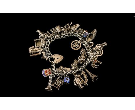 A Vintage Sterling Silver Charm Bracelet Loaded with 28 Silver Charms, Various Subjects Both Bracelet and All Charms, Marked 