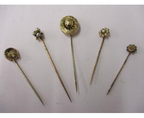 Five gold stick pins to include two with split seed pearls 