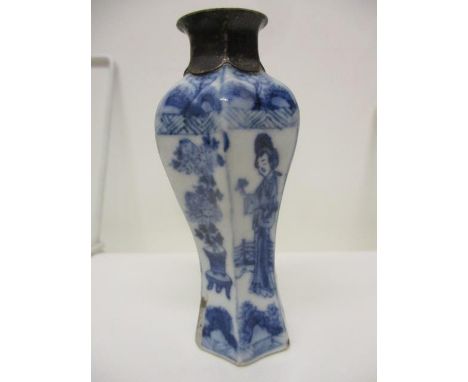 A Kangxi Chinese blue and white perfume bottle of waisted, inverted hexagonal form, decorated with alternating panels of a wo
