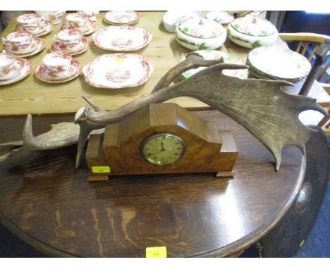 An Art Deco inlaid walnut cased mantle clock and a pair of antlers 