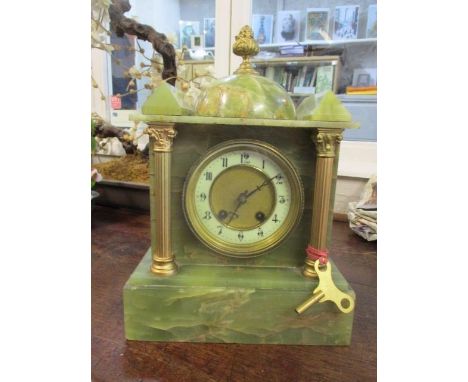 An early 20th century onyx mantle clock of architectural form with a gong strike movement, 12" h 