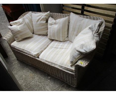 A conservatory rattan sofa and two matching chairs 