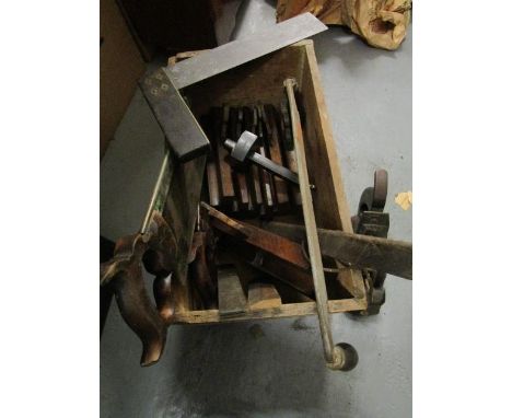 A selection of 19th century woodworking tools to include a Calloway & Co plane, saws, planes and other items in a vintage Pol