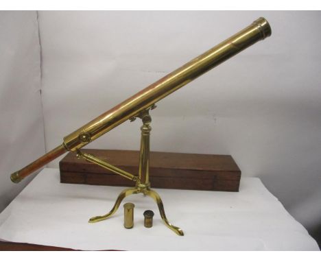 A 19th century brass table top telescope on a folding tripod stand 31" l with an additional lens and a mahogany carrying case