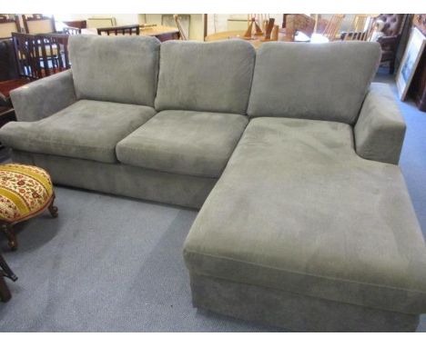 A large, modern grey upholstered sofa with matching stool to convert to a corner sofa 