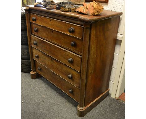 A Victorian mahogany 'Scotch' chest, shaped rectangular top above five long graduated cockbeaded drawers, flanked by near-cyl