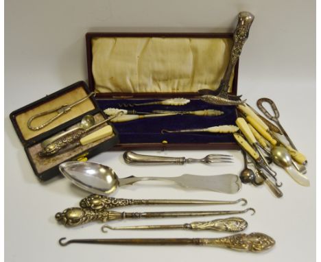 Silver button hooks, various (5); others; silver salt spoon;others; an American silver table spoon.