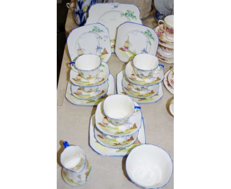 A Foley China part tea service for six, printed with a windmill in a landscape, 709