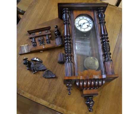 A mahogany cased Vienna type wall clock, architectural pediment crested by an eagle, 103cm high