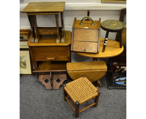 A 19th century oak purdonium;  oak drop lead occasional table; an oak nest of two tables; an oak sewing box; a yew wood occas