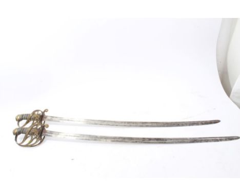 Two unusual Victorian 1854 pattern Infantry NCO's swords with brass Gothic hilts with fish-skin grips and unusual fullered bl