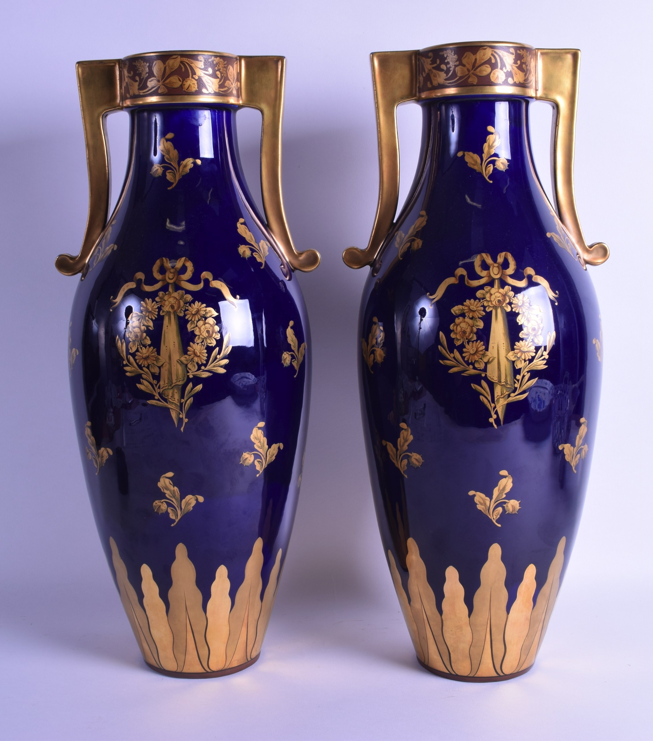 A GOOD LARGE PAIR OF LIMOGES TWIN HANDLED PORCELAIN VASES painted with