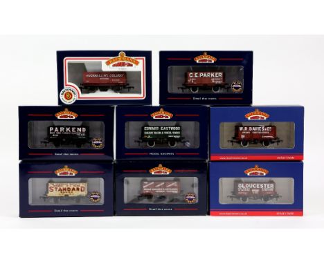 Fourteen Bachmann 00 gauge wagons, comprising 37080K 7-plank end door wagon 'Edward Eastwood', 37080W 7-plank wagon 'Derbyshi