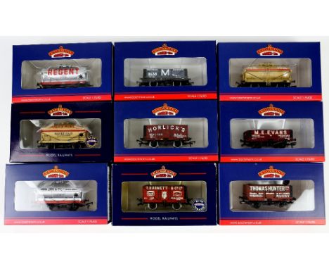 Thirteen Bachmann 00 gauge wagons, comprising 372017K 5-plank wagon 'M E Evans', 372016K 7-plank end door wagon 'Horlicks', 3
