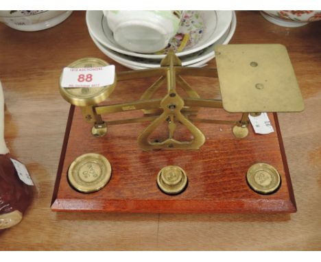 A set of brass and letter scales and weights