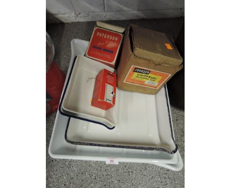A selection of printers and photography enamel ceramic and plastic developing trays with tank, probeta and focus finder