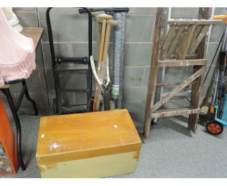 A selection of garden and work tools including metal sack truck