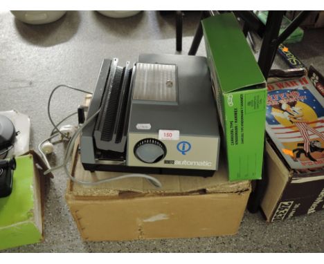 A Boots automatic slide projector with box and slide trays