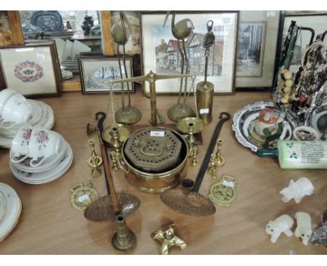 A selection of brass ware including balance scales, horse brass etc