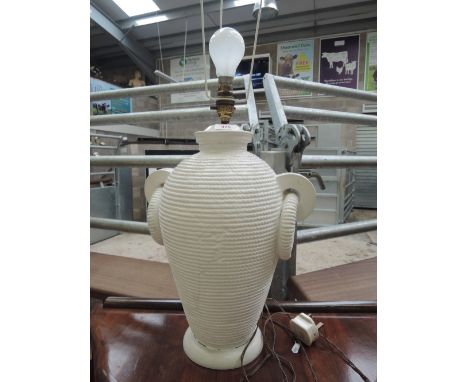 A vintage art pottery table lamp of basket form