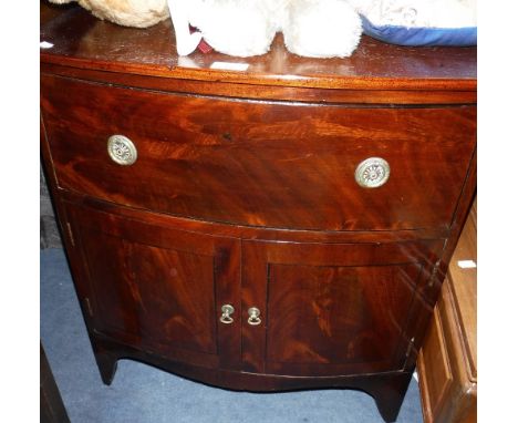 A GEORGE III BOWFRONTED MAHOGANY COMMODE converted to a cupboard