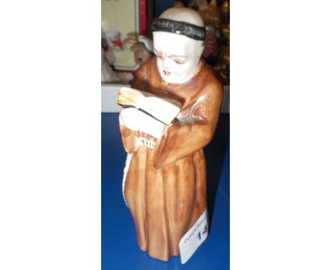 A ROYAL WORCESTER CANDLE SNUFFER in the form of a monk
