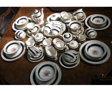A CREAM PETAL GRINDLEY PART TEA SERVICE with floral decoration and blue and gilt borders