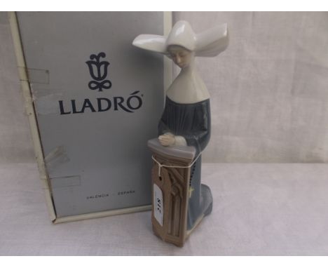 Lladro figure of a young nun in meditation (Number 5502)