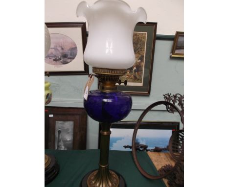 Large ornate circular pot based lamp with shaped corinthian column, cobalt blue bowl and shaped clouded white glass shade wit