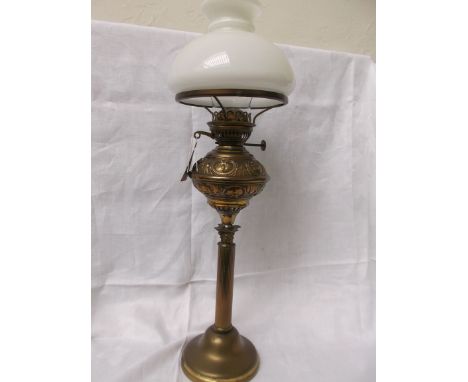 Brass table lamp with clouded white glass shade and chimney