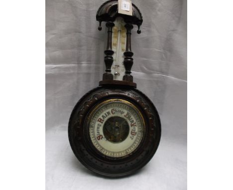 Aneroid barometer with thermometer dial in carved oak banjo style case
