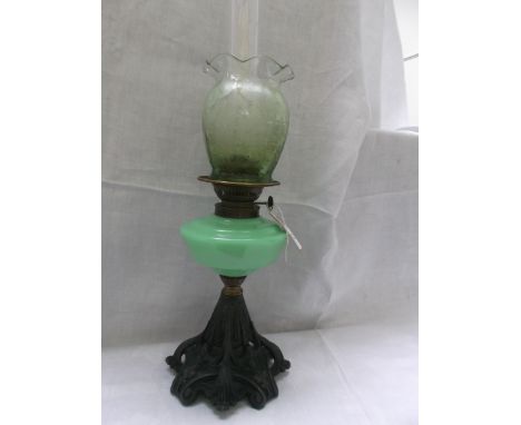 Metal based table lamp with lime green clouded glass bowl and a most decorative floral etched dark green shade and chimney