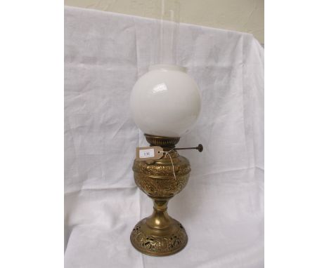 Brass table lamp with domed clouded white glass shade and chimney