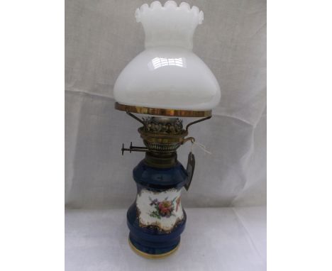 Decorative blue pot based table lamp with painted coloured floral panel with clouded glass shaped shade and glass chimney