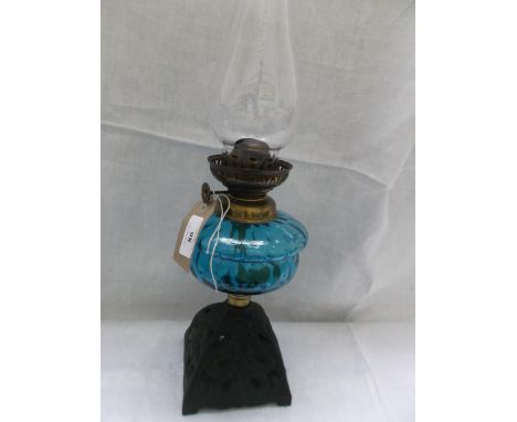 Metal based table lamp with light blue bowl and chimney