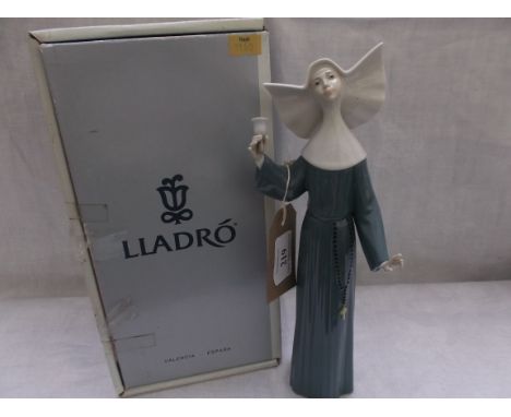 Lladro figure of a young nun in blue cossack call to prayer (Number 5551)