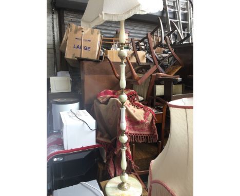 AN ONYX AND BRASS EFFECT STANDARD LAMP