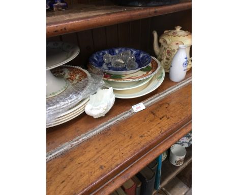 SHELF OF POTTERY