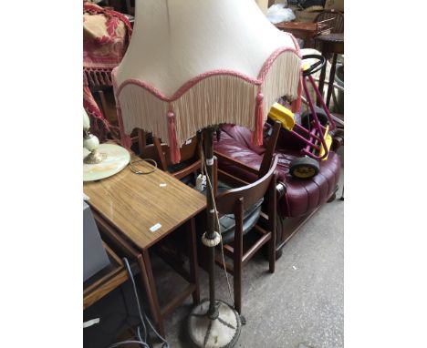 AN ONYX AND BRASS EFFECT STANDARD LAMP