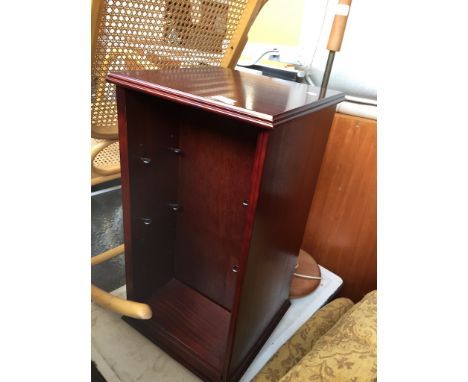 A SMALL BOOKCASE AND A RETRO LAMP