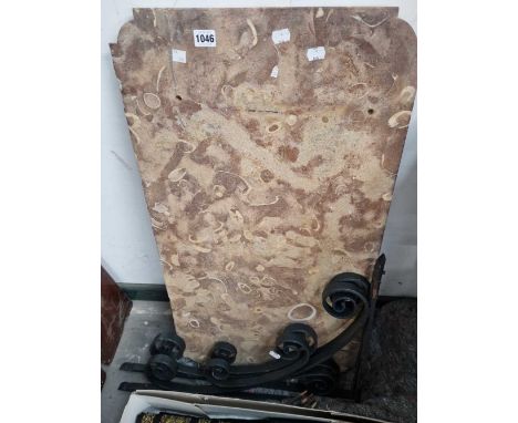A marble top console table with wall brackets.